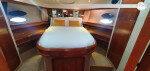 Three-cabin motor boat available for day charter in Alicante, Spain.
