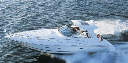 Three-cabin motor boat available for day charter in Alicante, Spain.